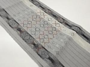 変わり縞に抽象菱模様織出し袋帯